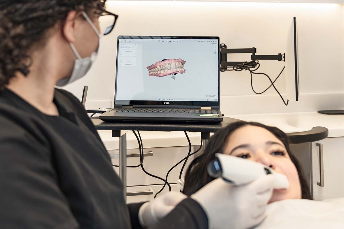 dentist performing digital orthodontic scan to evaluate bite alignment and orthodontic conditions at NYC Dentistry Center in Midtown Manhattan