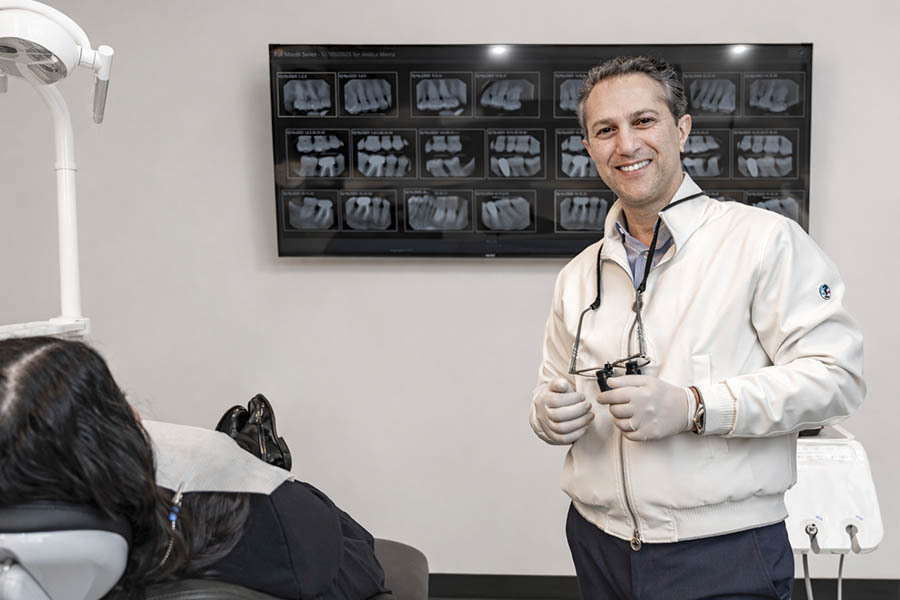 Dental crowns consultation in NYC with dentist explaining crown procedure and treatment options to patient
