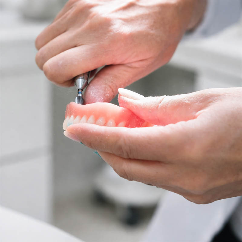 Professional denture repair and adjustment restoring fit and comfort in Midtown Manhattan NYC