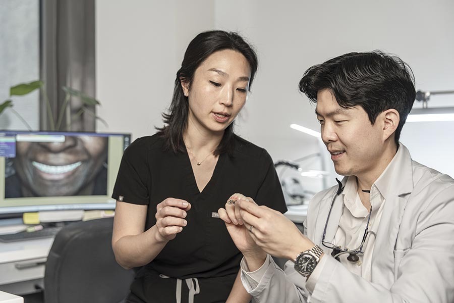 Prosthodontist explaining Nesbit partial denture option to patient during consultation in Midtown Manhattan NYC