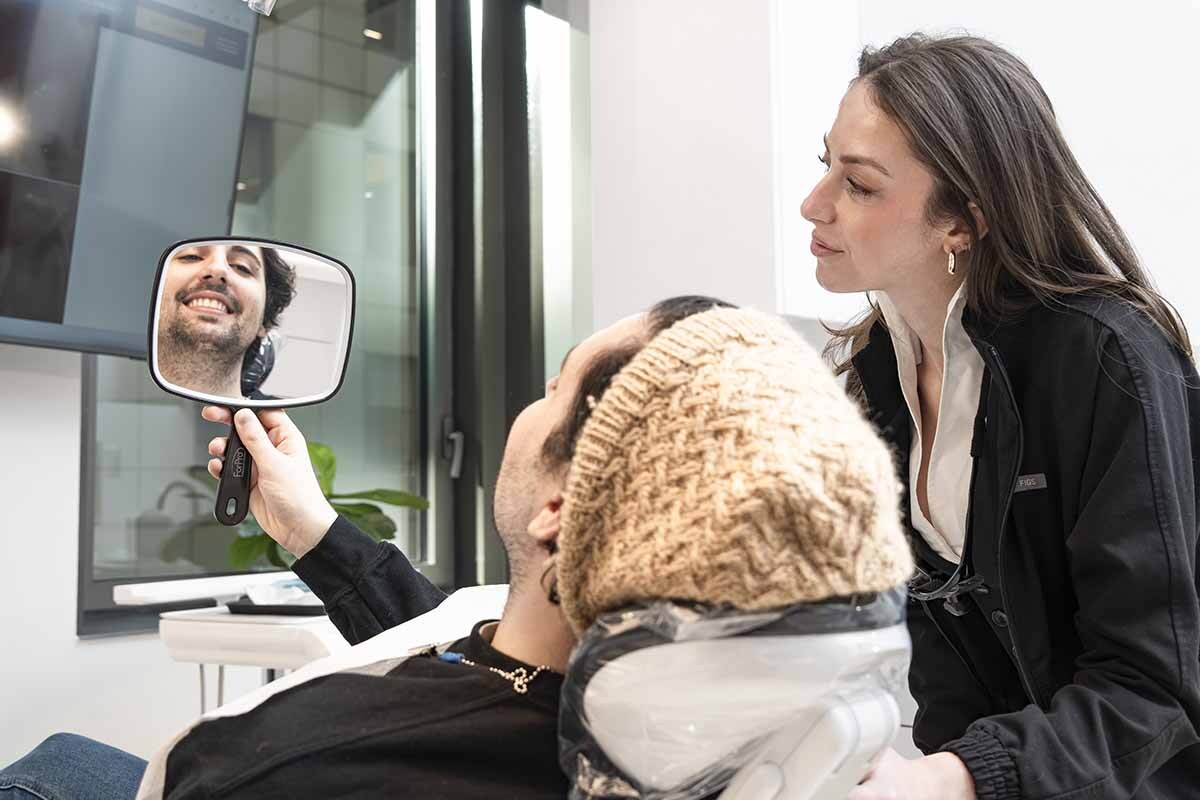 NYC dentist speaking with patient during personalized patient centered dental care consultation in Midtown East Manhattan